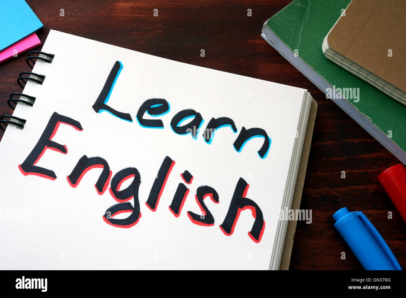 Impara Inglese scritto su un blocco note con il marcatore. Foto Stock