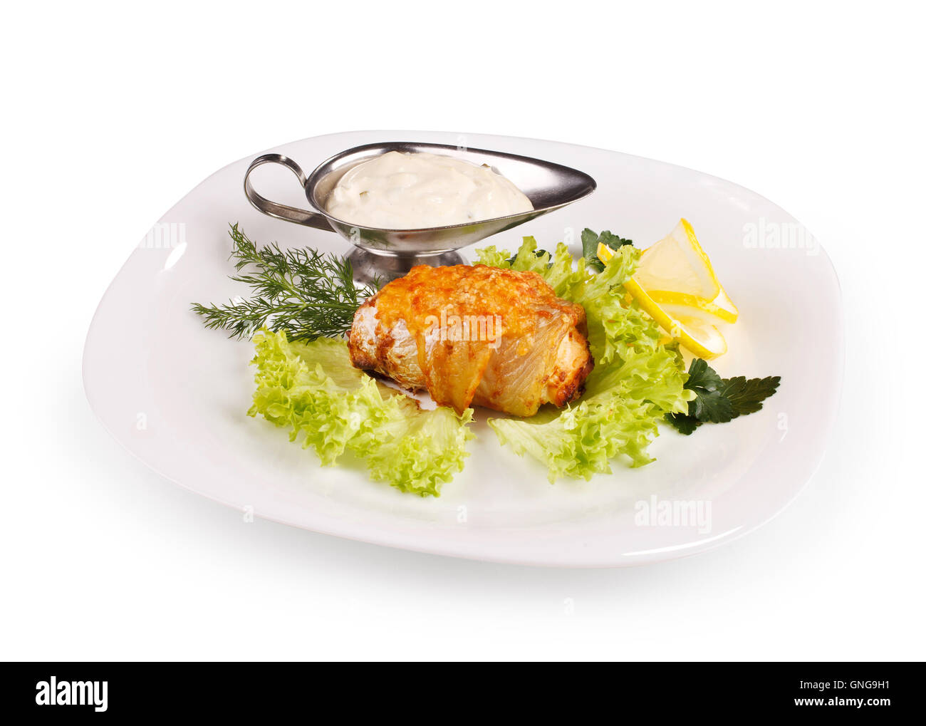 Di carne con salsa su una piastra bianca Foto Stock