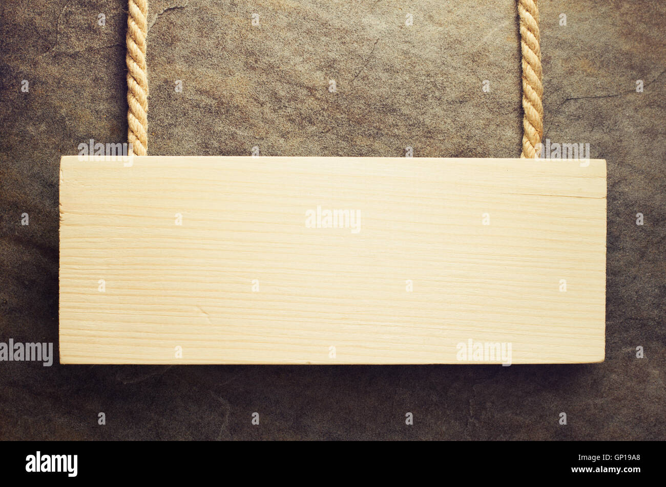 Cartello appeso al muro sfondo Foto Stock