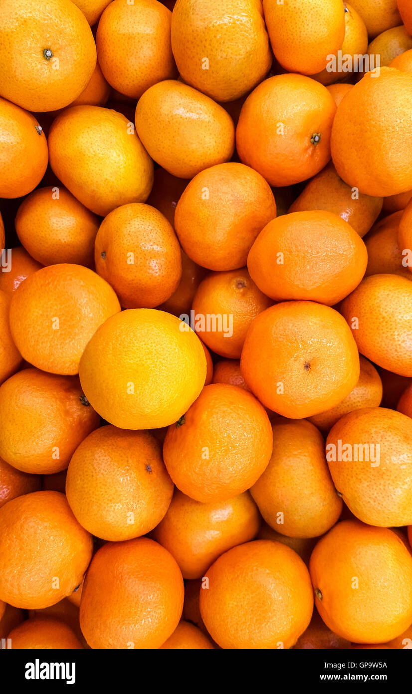 Mature tangerini come sfondo. Foto Stock