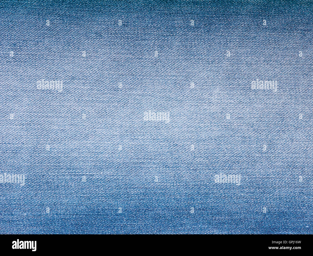 Luce blu lavato sbiadito di tessuto denim sfondo Foto Stock
