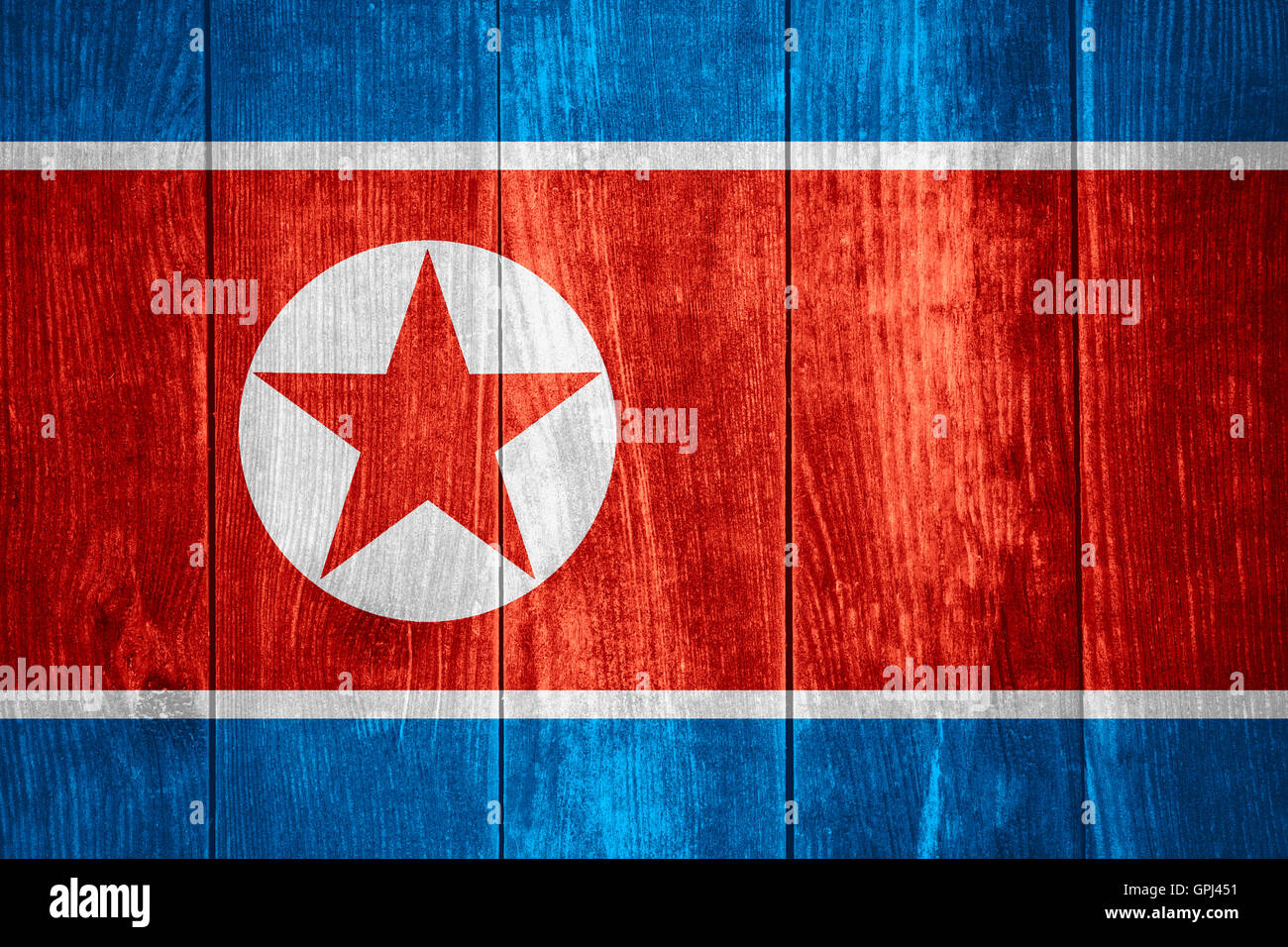 Bandiera della Corea del Nord o Corea del Nord banner su sfondo di legno Foto Stock