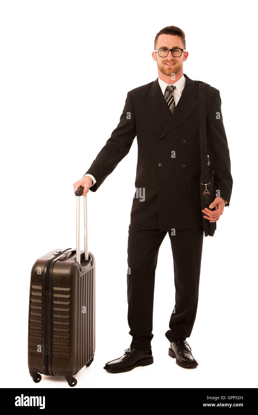 Imprenditore di successo in abito formale e valigetta di andare in viaggio d'affari isolato su bianco. Foto Stock