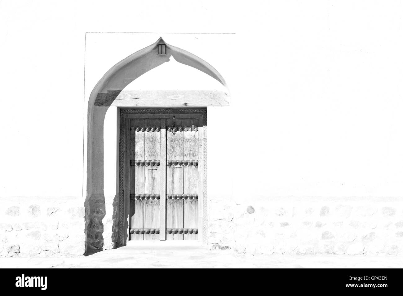 Oman vecchia porta di legno e la parete della casa Foto Stock