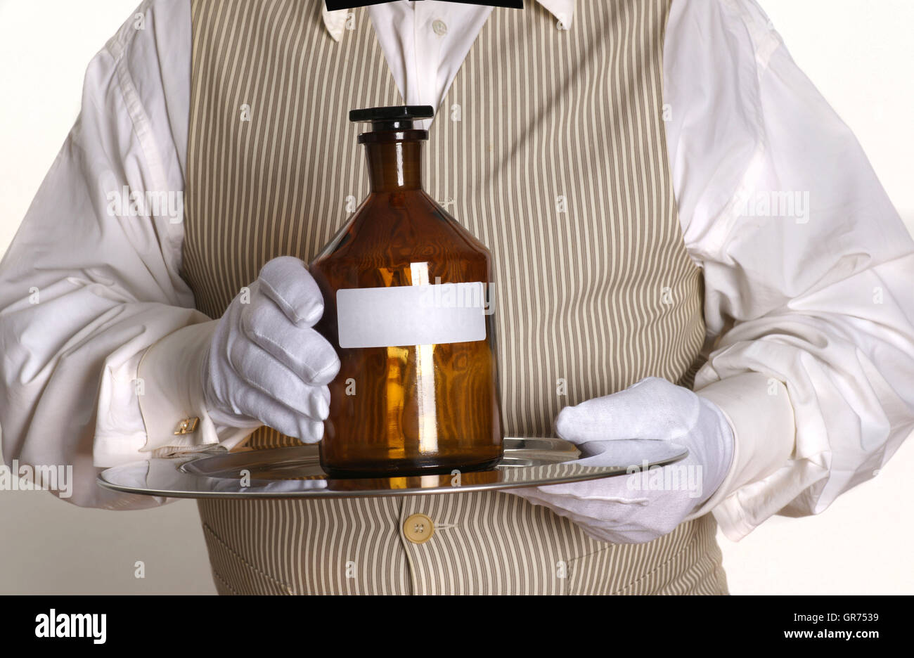 Il maggiordomo con un Medizin-Bottle Foto Stock