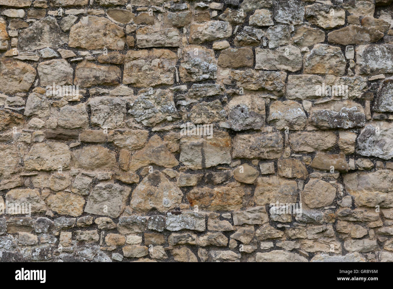 Il vecchio muro di pietra colpo di sfondo Foto Stock