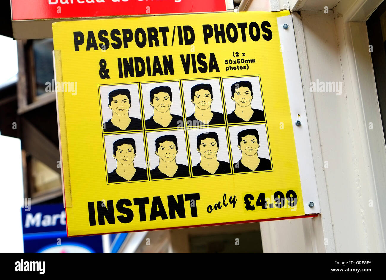 Fototessere & indiana visa firmare al di fuori del negozio in Norfolk, Inghilterra Foto Stock