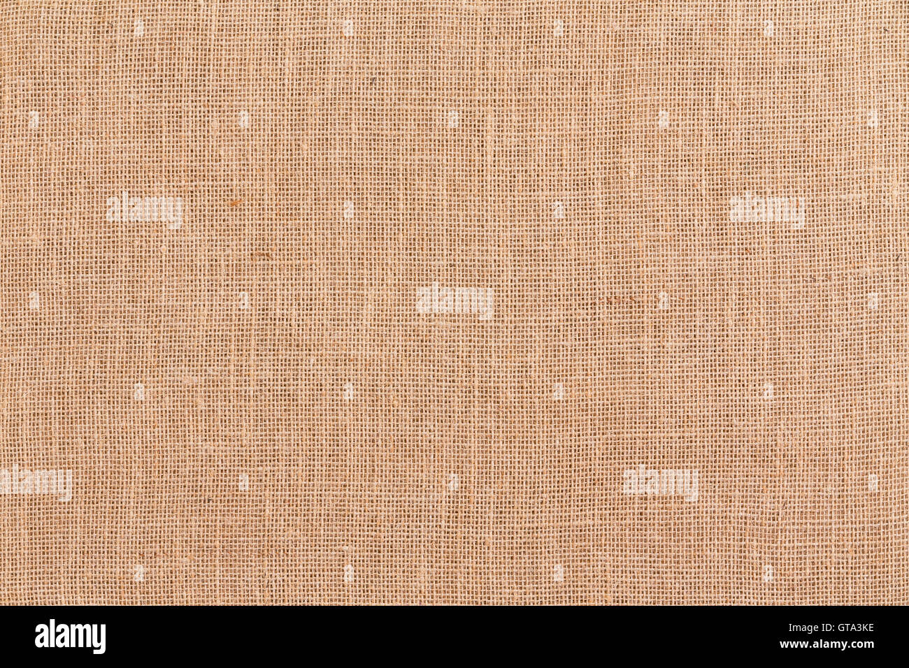Telaio completo marrone tela tessuta o hessian tessile texture di sfondo realizzato da tessuti in fibre naturali visto da vicino il sovraccarico Foto Stock