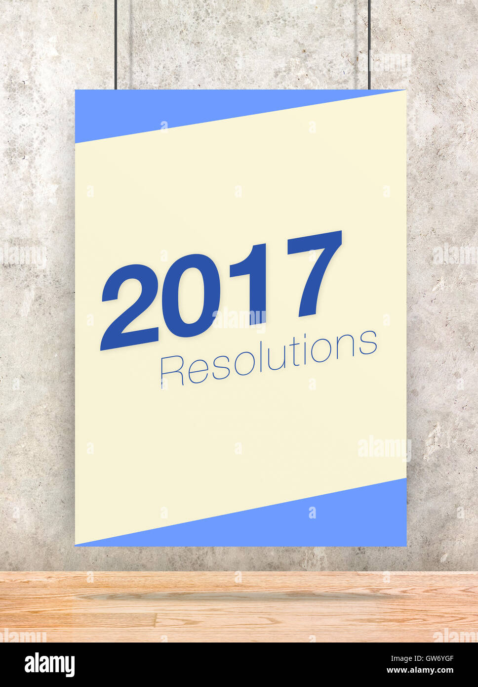 2017 risoluzioni sulla crema e blu colore pastello poster appeso alla parete di cemento e pavimento in legno,Holiday greeting card. Foto Stock