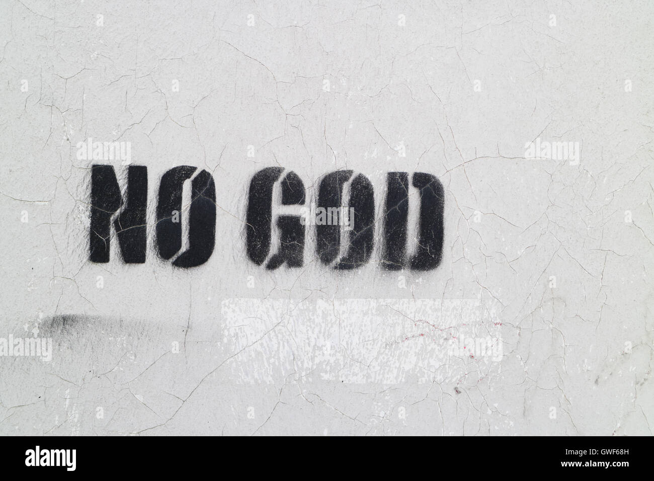 Graffiti su un muro dicendo "No Dio' Foto Stock