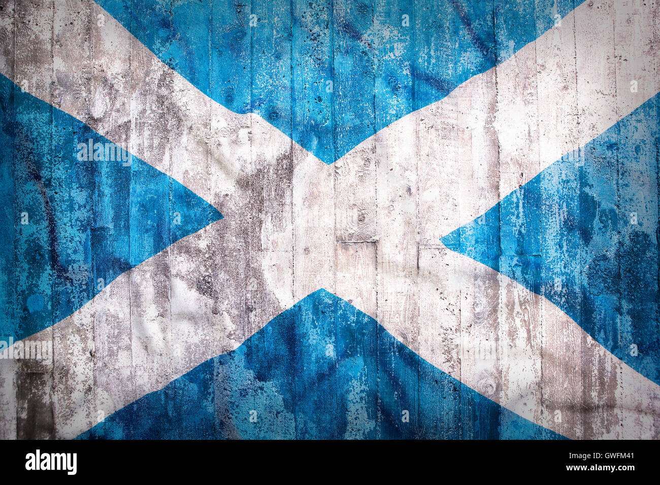 Stile grunge di Scozia bandiera su un muro di mattoni per lo sfondo Foto Stock