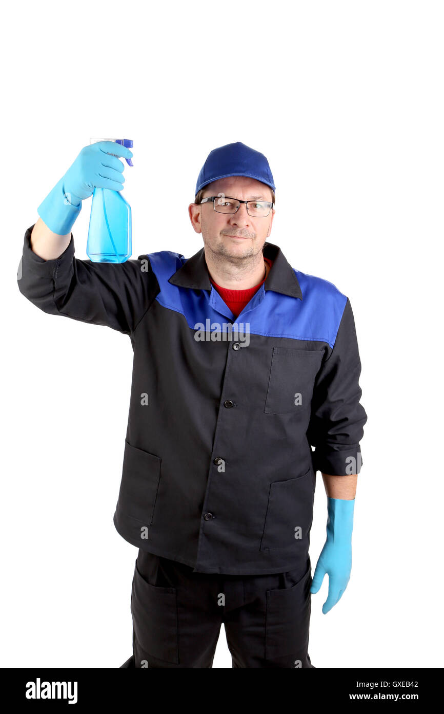Uomo in abbigliamento da lavoro con un flacone spray Foto stock - Alamy