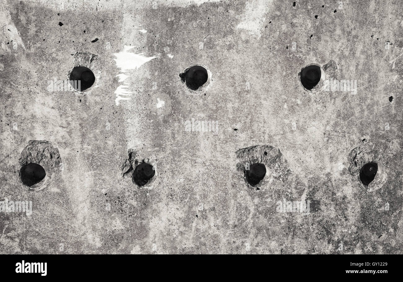 Una schifezza di cemento grigio blocco di muro texture con fori tecnologico Foto Stock