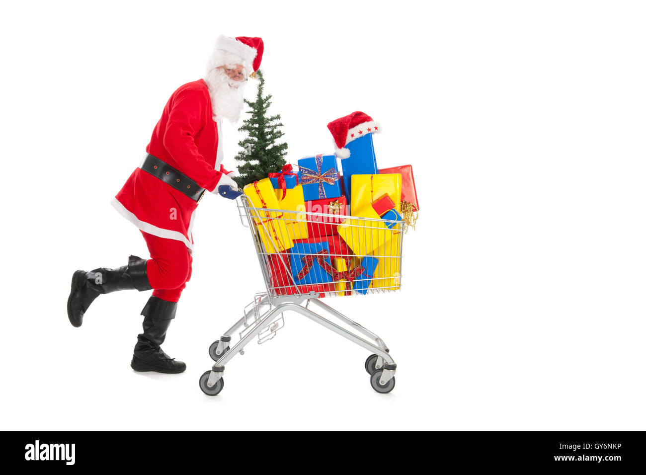 Santa Claus in esecuzione con carrello Foto Stock