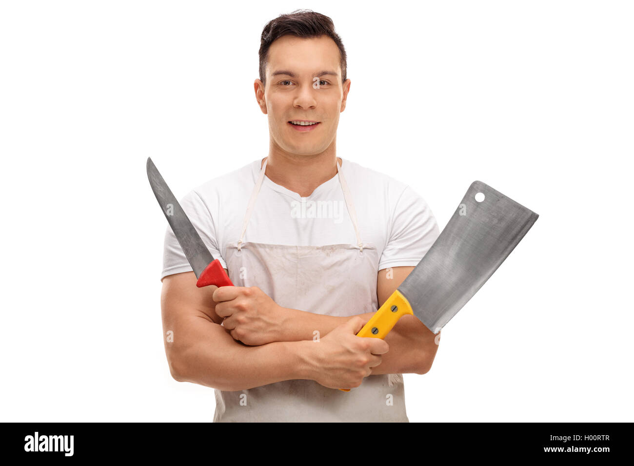 Butcher tenendo un geniale e un coltello isolati su sfondo bianco Foto Stock