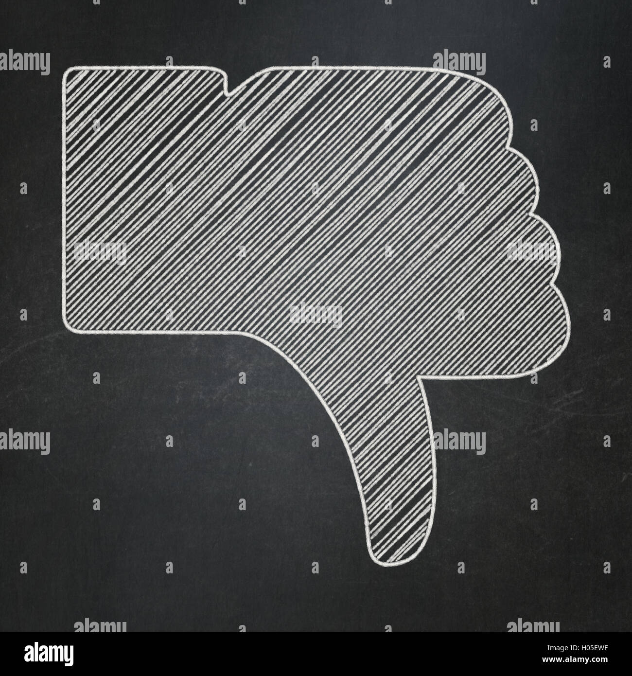 Social media concetto: il pollice verso il basso su sfondo lavagna Foto Stock