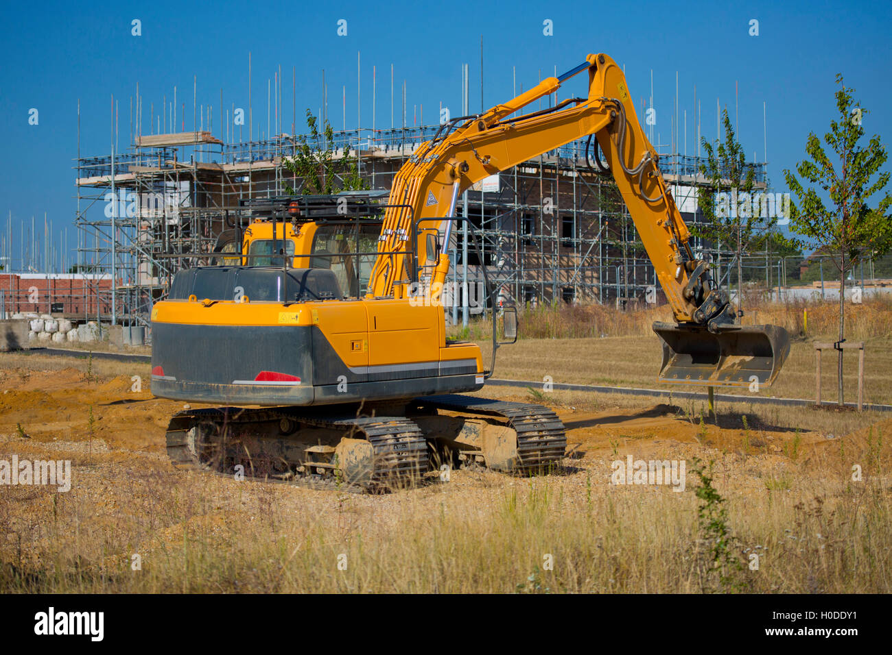 Una scavatrice o un scavatrice o il retroescavatore su un sito di costruzione o di cantiere Foto Stock