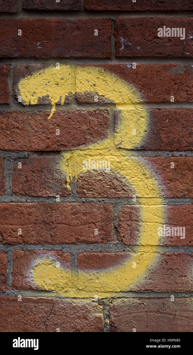 Numero 3 verniciato a spruzzo su una parete Foto Stock