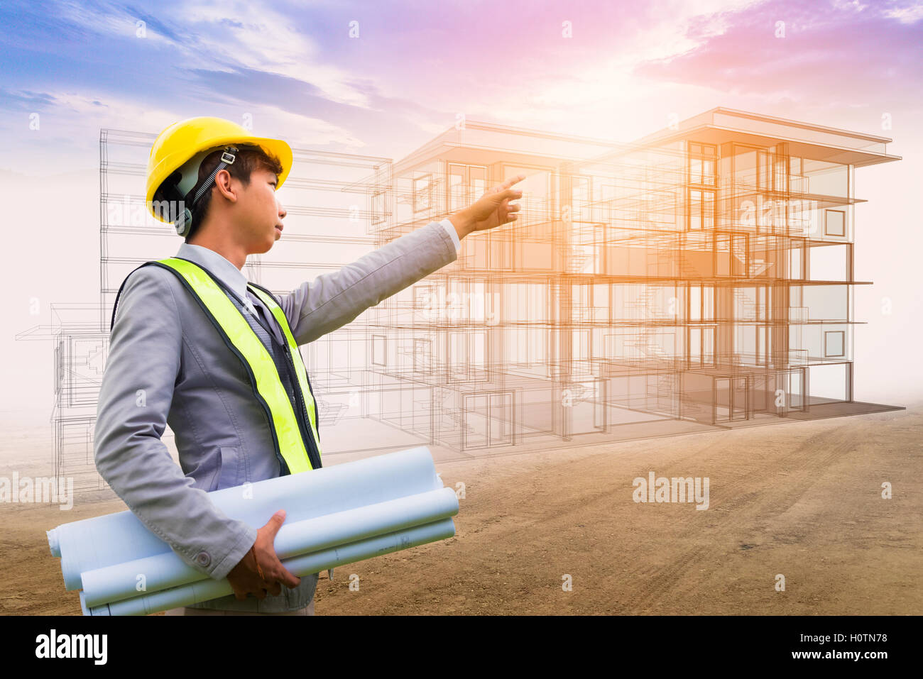 Asia giovane designer o ingegnere azienda blueprint nelle sue mani su immagine di sfondo edificio schizzo in futuro Foto Stock