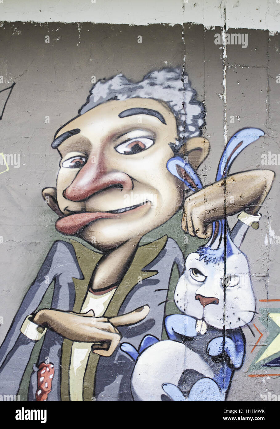 Mago con coniglio arrabbiato, disegno sulla parete Foto Stock