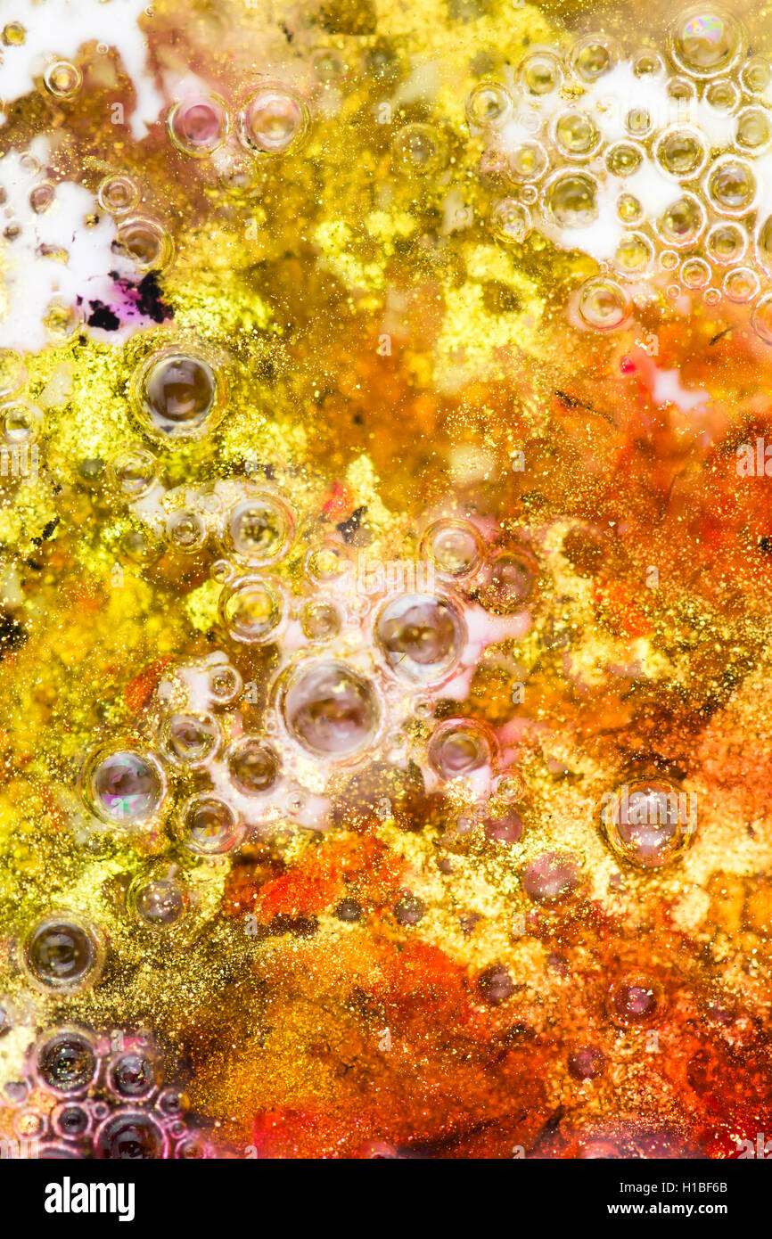 Arancione, giallo e glitter sfondo astratto con bolle Foto Stock