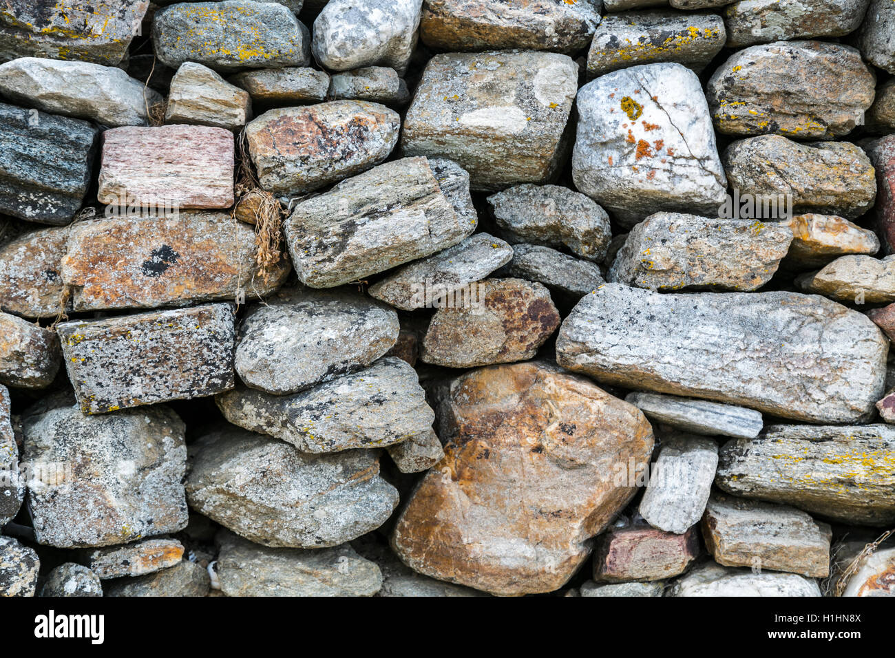 Antico muro di pietra naturale sfondo pattern. Foto Stock
