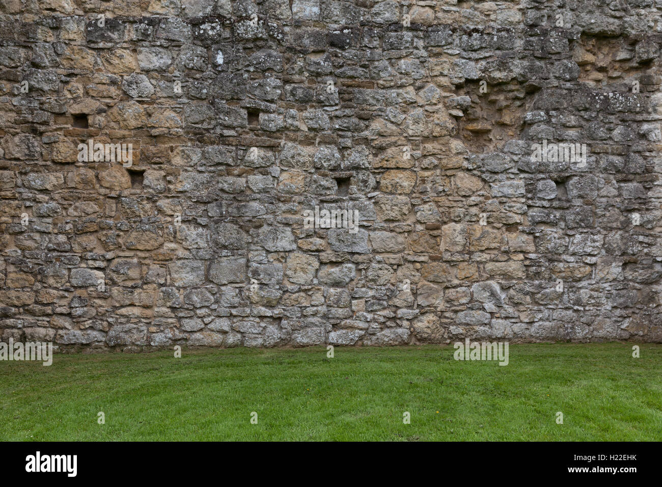 Il vecchio muro di pietra colpo di sfondo Foto Stock