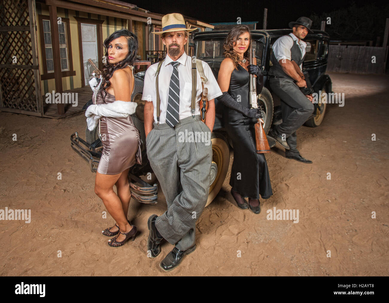 Quattro banditi armati di pistole Foto Stock