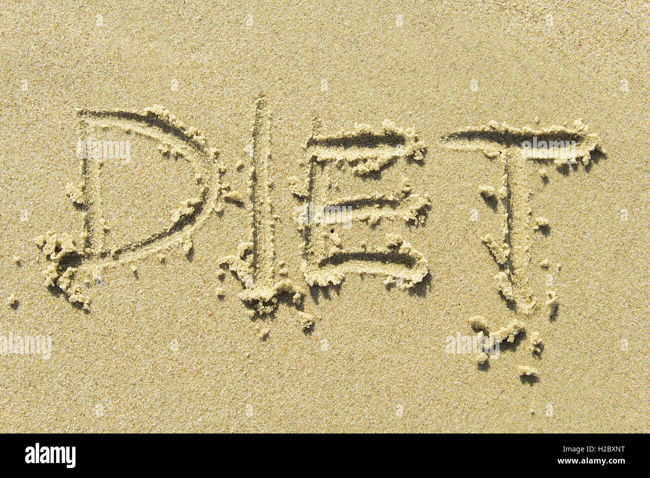"Diet' - scritta a mano in spiaggia di sabbia Foto Stock