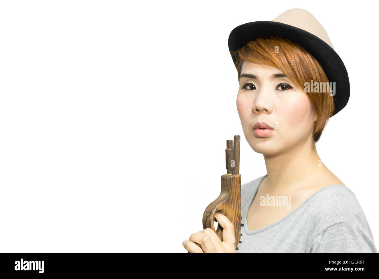 Ritratto di donna in Asia con pistola giocattolo Foto Stock