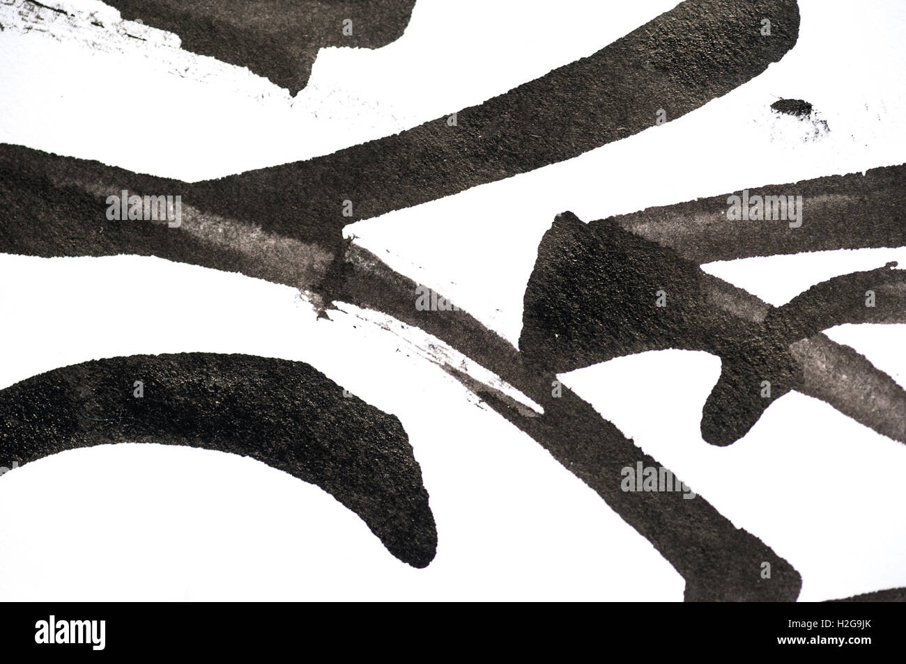 Abstract di nero i tratti di pennello su carta bianca Foto Stock