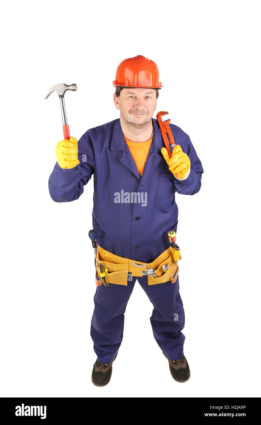 Lavoratore nel casco di protezione tenendo un martello. Foto Stock