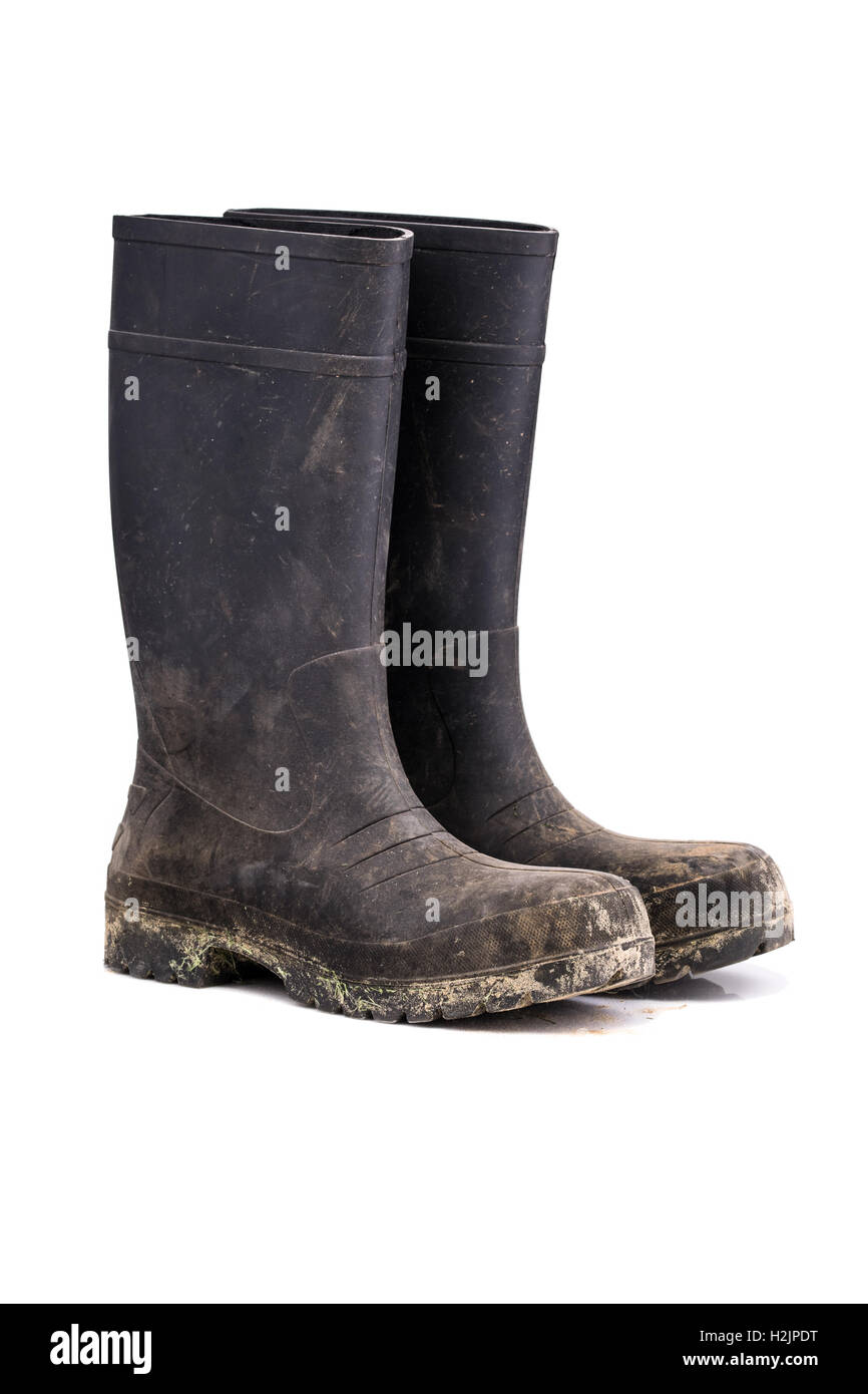 Sporco secco stivali fango isolato puro su sfondo bianco vista di 3/4 Foto Stock