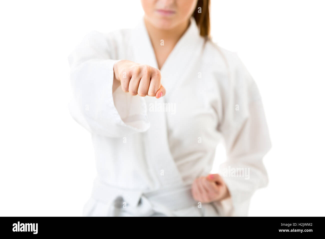 Bella caucasici, giovane donna, esecuzione di karate Foto Stock