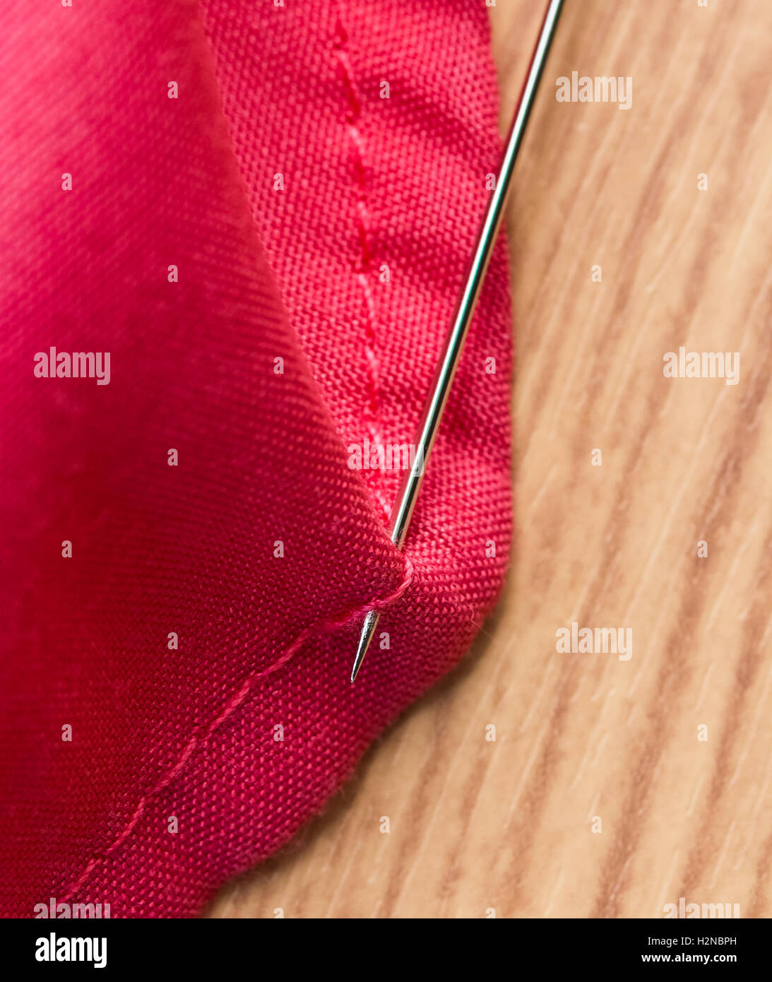 Panno di cucitura che indica sarta abbigliamento e tessili Foto Stock