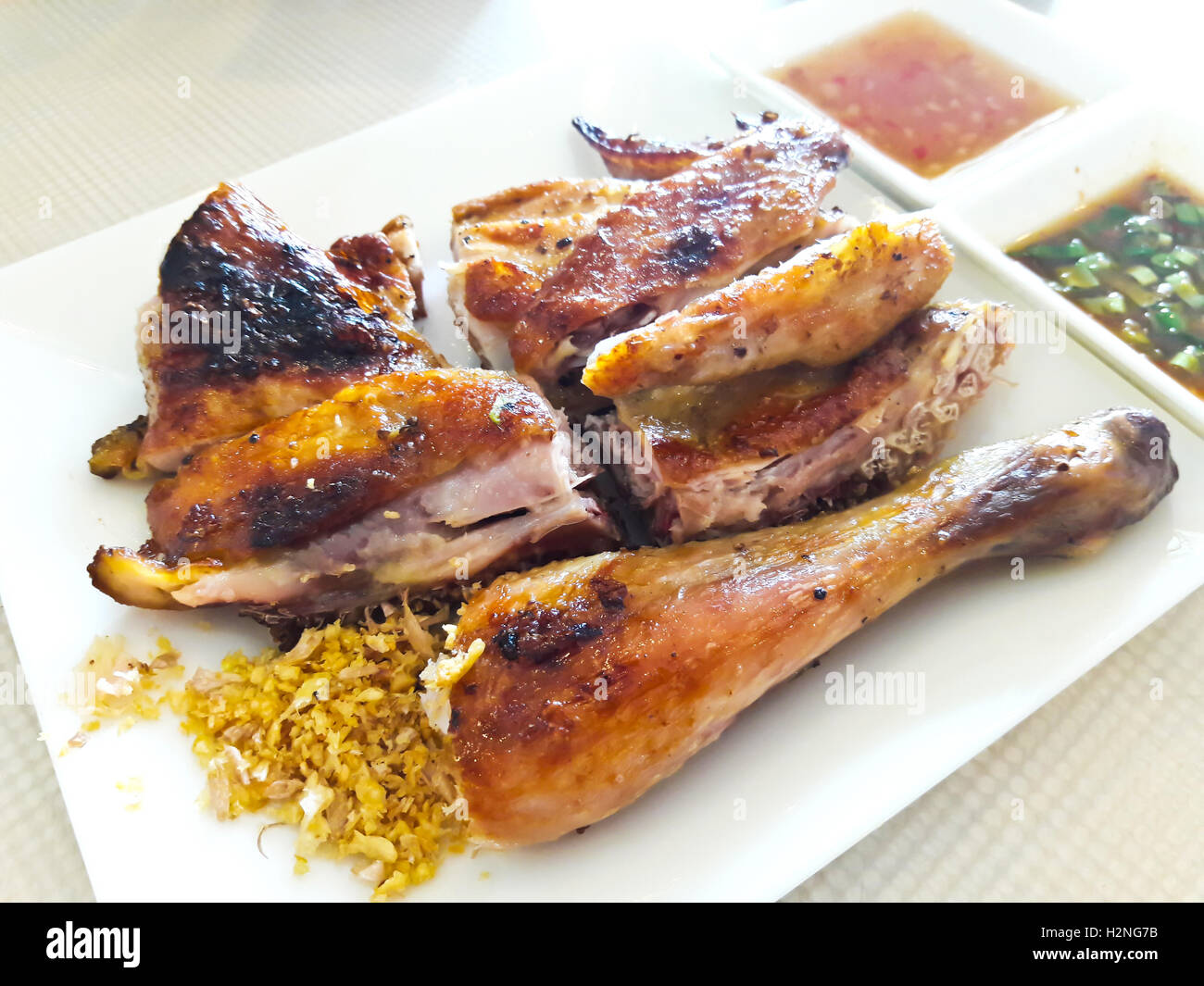 Thai pollo grigliato con salsa piccante Foto Stock