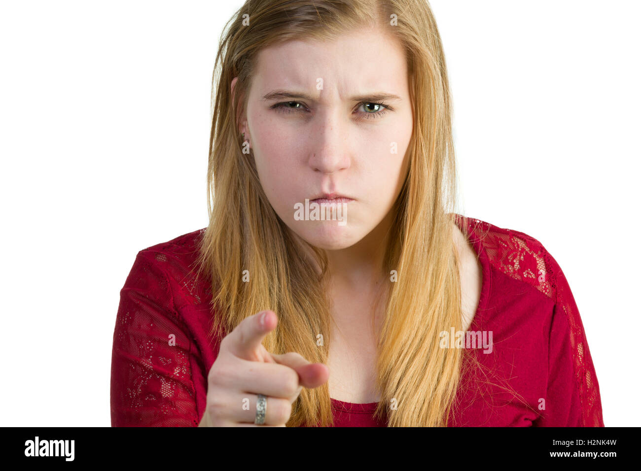 Un molto infastidito donna punto il suo dito Foto Stock
