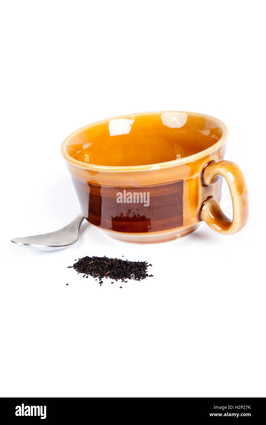 Tazza vuota di tè con un cucchiaio Foto Stock