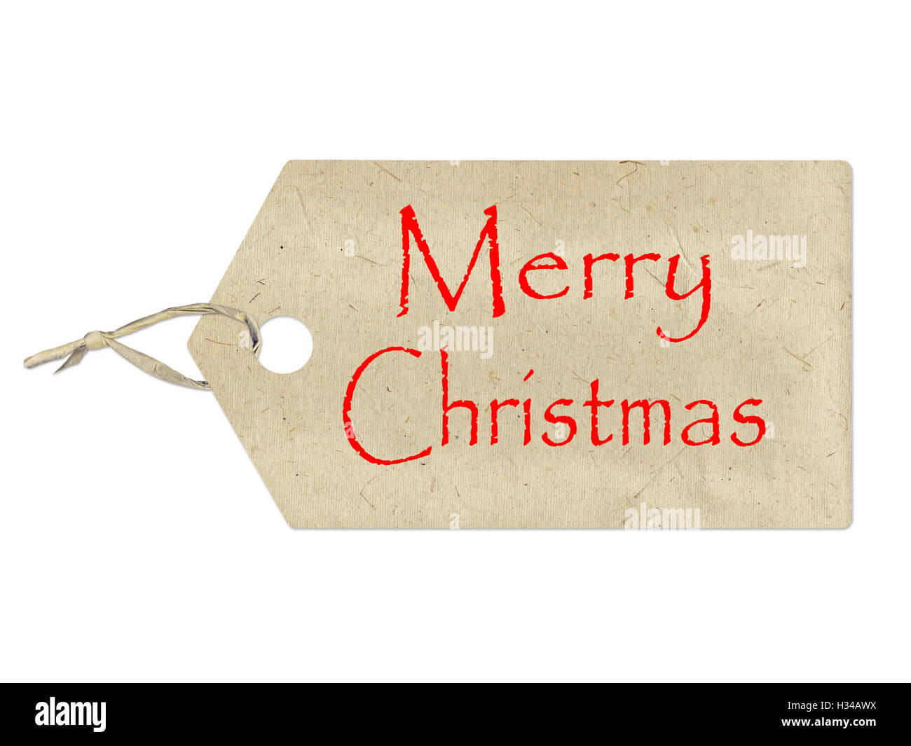 Buon Natale scritta su una carta marrone etichetta su sfondo bianco Foto Stock