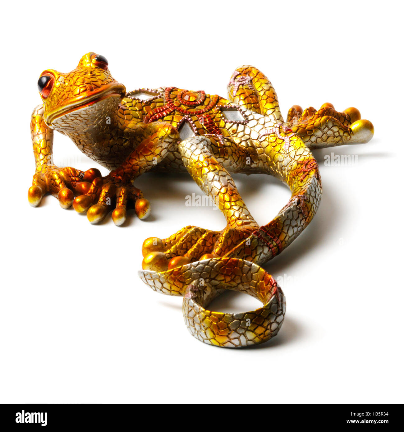 Statuetta luminoso della lucertola isolati su sfondo bianco Foto Stock