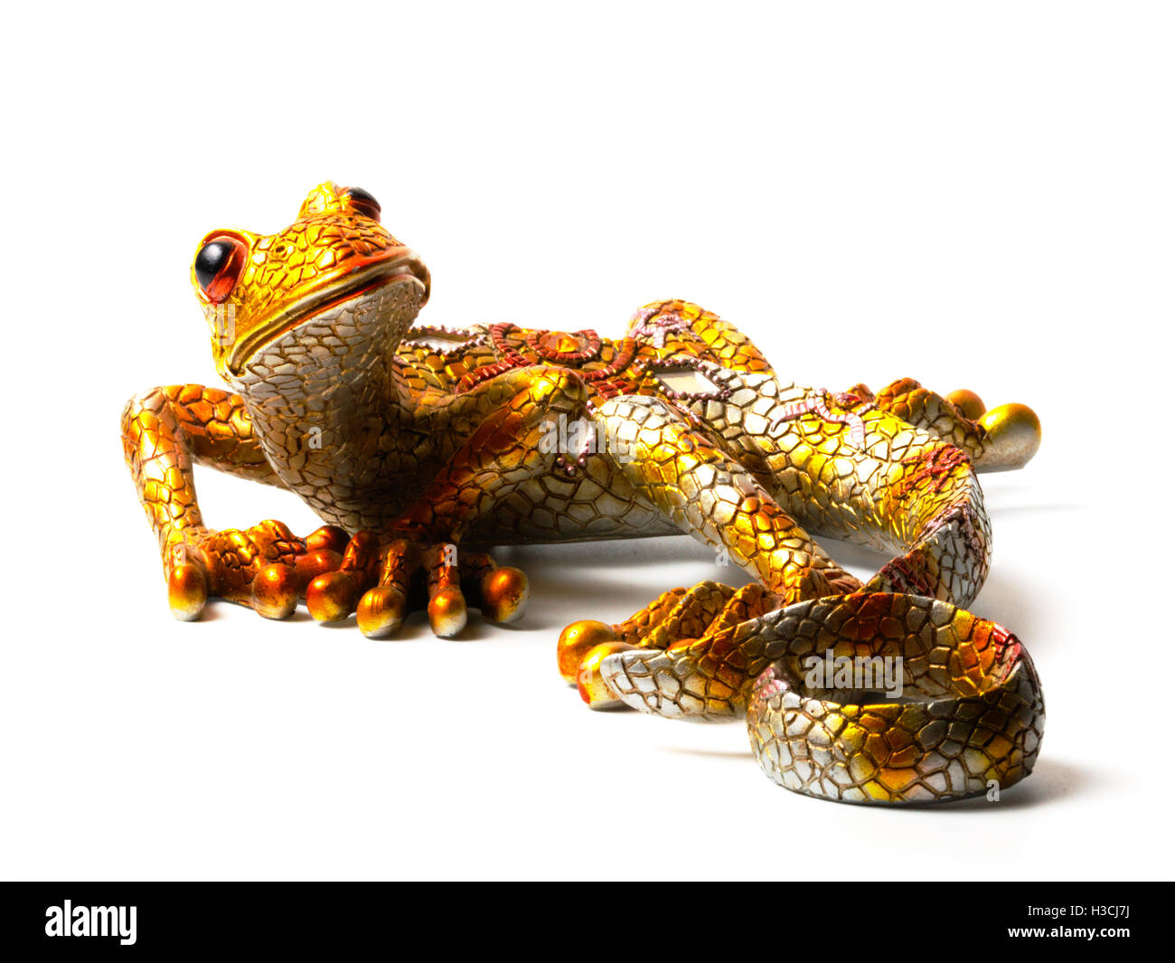 Statuetta luminoso della lucertola isolati su sfondo bianco Foto Stock