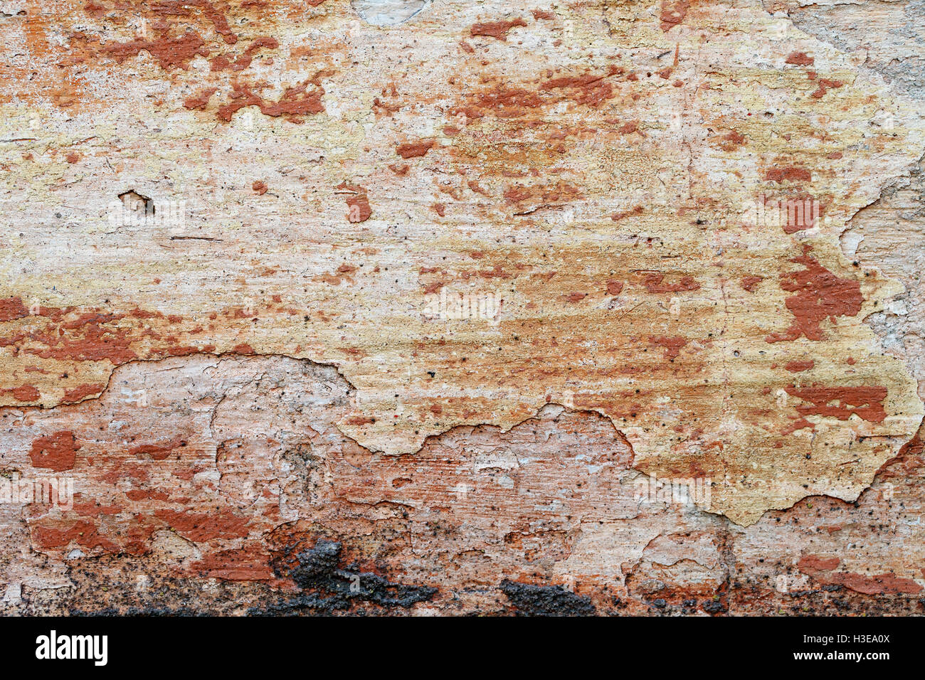 Una texture grunge del vecchio muro rosso Foto Stock