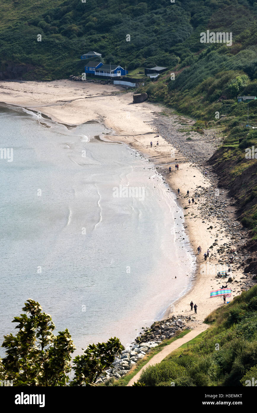 La bellissima Runswick Bay Spiaggia curvo e spazzare via mare in North Yorkshire England Regno Unito Regno Unito Foto Stock