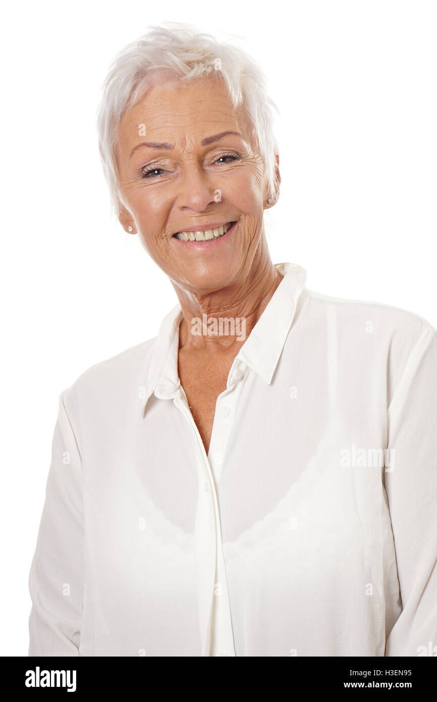 Fiducioso donna matura con i capelli bianchi Foto Stock