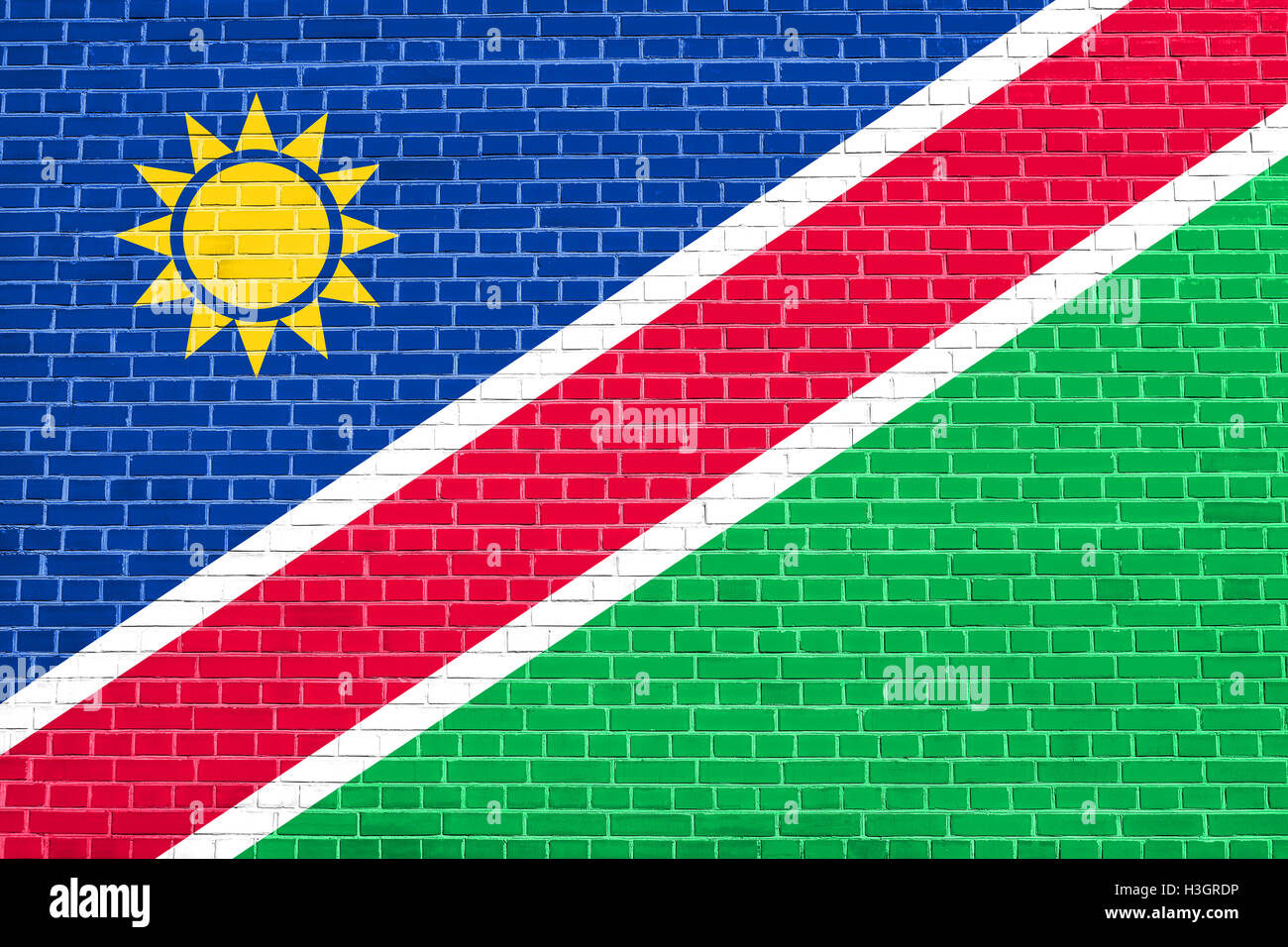 Nazionale della Namibia bandiera ufficiale. Africa simbolo patriottico, banner, elemento dello sfondo. Bandiera della Namibia su un muro di mattoni texture Foto Stock