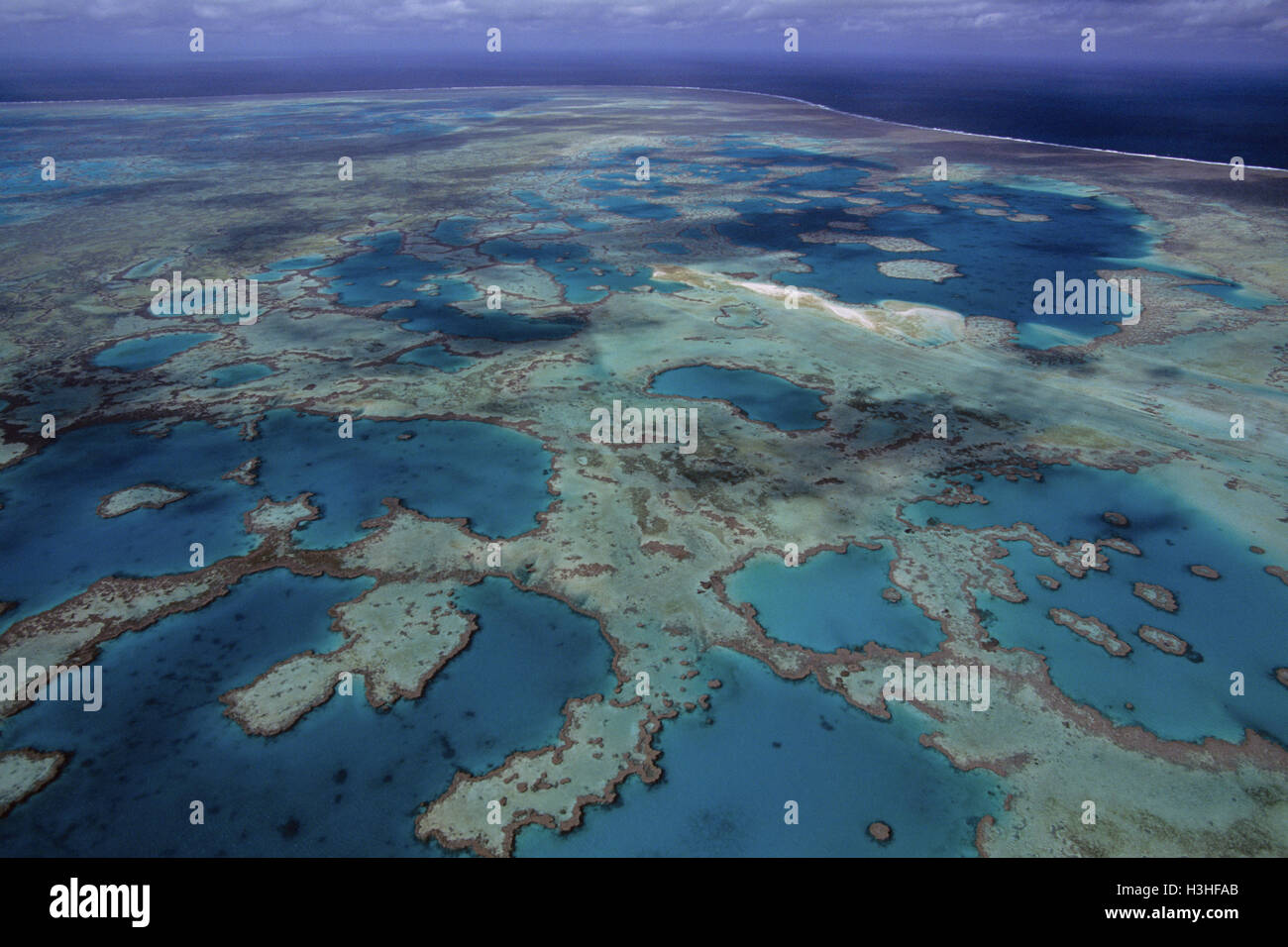 Complesso di Pompeo reef e nuovo sandy cay in formazione. Foto Stock