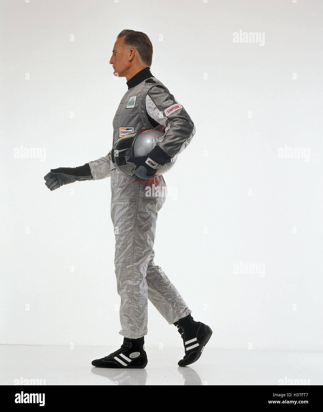 Motor Sport racing driver, complessivamente, casco, argento, motion, go, vista laterale, sport, sport racing, uomo racing tuta, casco, casco, elmetto, guanti, studio, Foto Stock