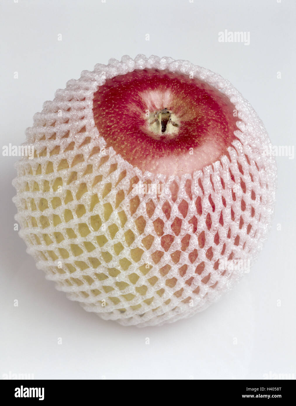 Apple, Busta, rete, frutta, frutta, Malus, protezione per il trasporto, la protezione, la busta di protezione, selleria, imbottiti, cibo, mangiare cibo, studio, still life Foto Stock