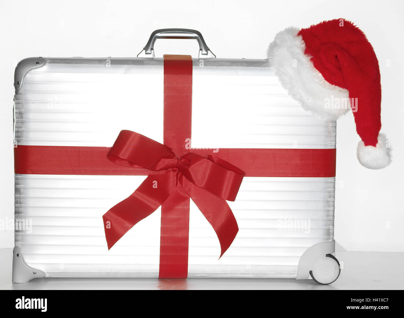 Case in alluminio, loop, rosso, Santa cappuccio della valigia, argento, argento, bagagli, viaggi, presente, regalo di Natale, sorpresa natalizia, vacanza, viaggio vacanza, Natale, Natale vacanze, vacanze di Natale, per Natale, Viaggi, viaggi all'estero, icona, recr Foto Stock