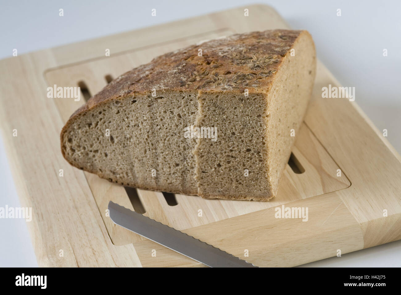 Pane e tagliate in quarti, legno tagliente springboard, Foto Stock